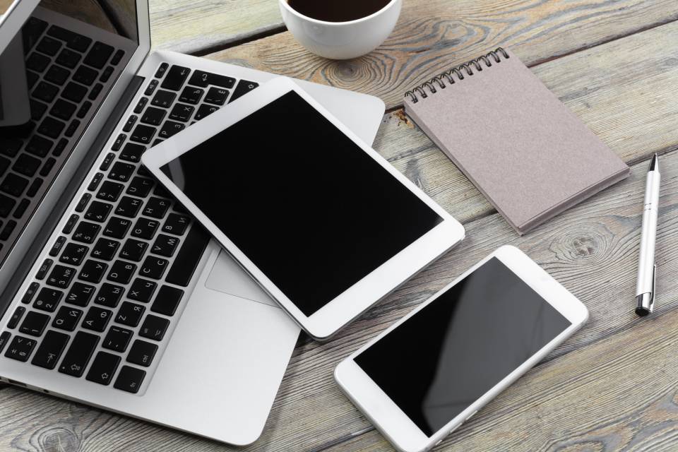Multiple devices connected through cloud services for seamless access and syncing across laptop, tablet, and smartphone Multiple devices connected through cloud services for seamless access and syncing across laptop, tablet, and smartphone
